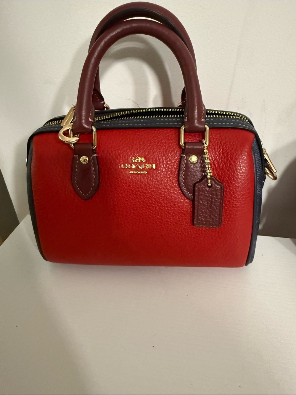 Coach Red Leather Mini Rowan with maroon Handles and Black Trim and charm bundle
